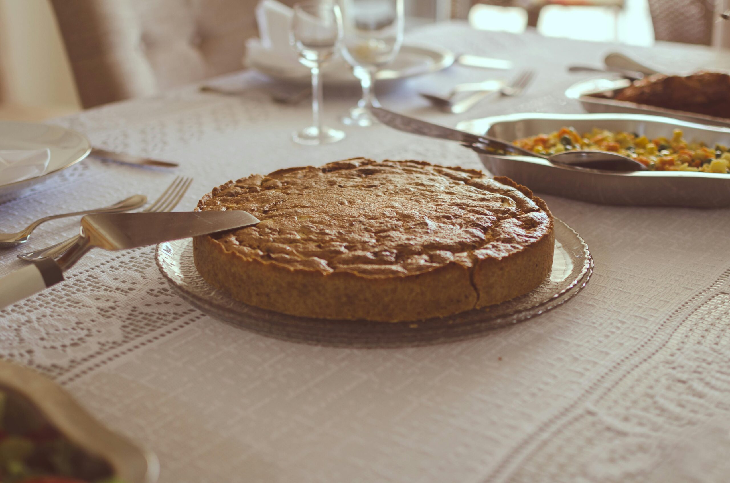 Delicious homemade pie served on a beautifully set table in Brasília. Perfect for a warm meal.